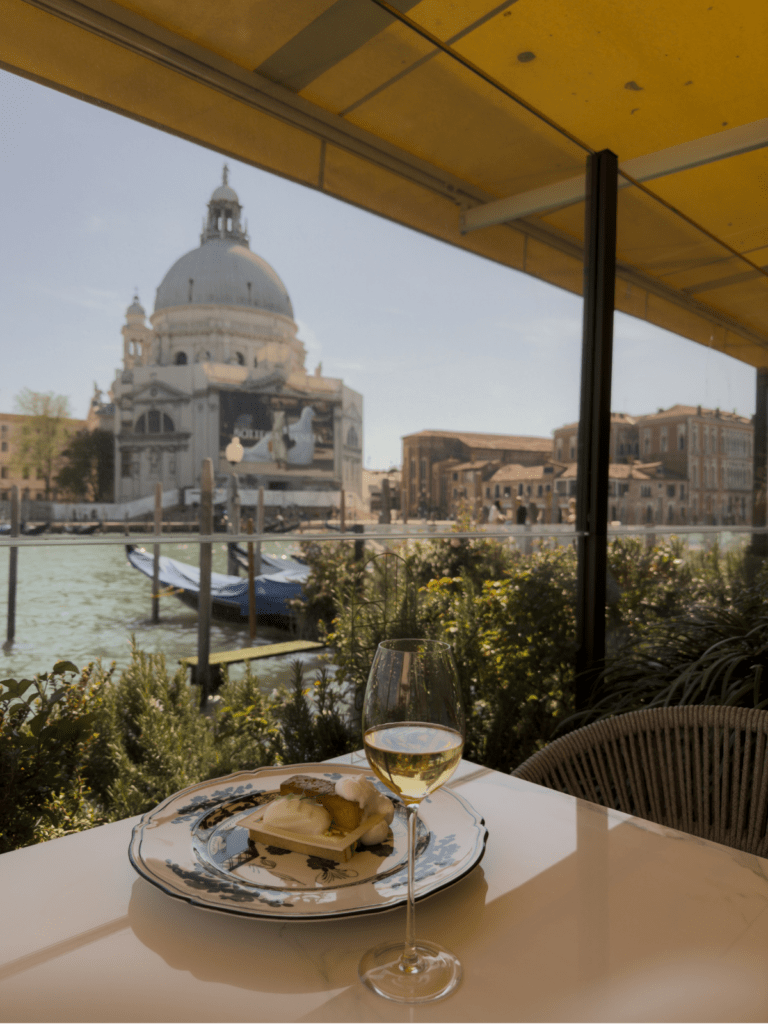View of Grand canal from author's table at Gio's restaurant at St. Regis with Santa Maria della Salute in background
