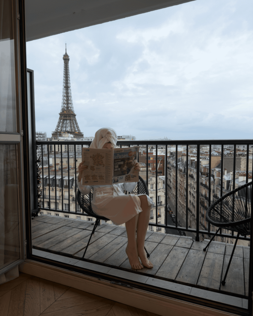 Author on balcony with Eiffel Tower view